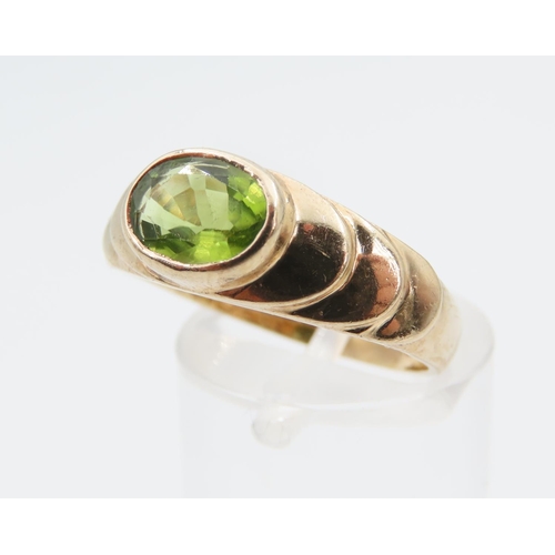 1275 - Peridot Centre Stone Ring Mounted on 9 Carat Yellow Gold Band Rub Over Setting Size O and a Half