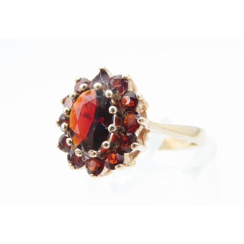 1276 - Red Garnet Cluster Ring Mounted on 9 Carat Yellow Gold Ring Size K