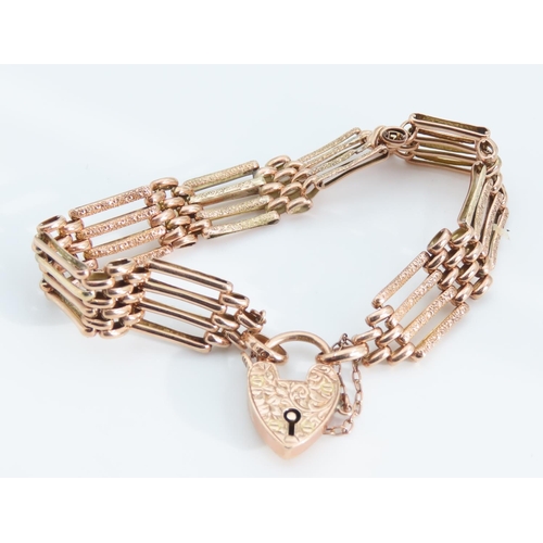 1279 - 9 Carat Rose Gold Four Bar Bracelet Articulated Form Heart Motif Padlock Clasp 18.5cm Long