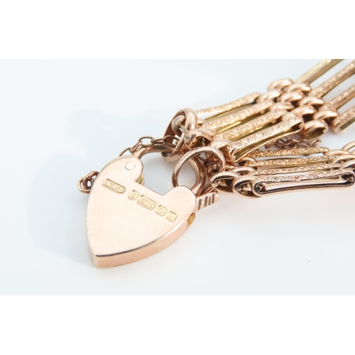 1279 - 9 Carat Rose Gold Four Bar Bracelet Articulated Form Heart Motif Padlock Clasp 18.5cm Long