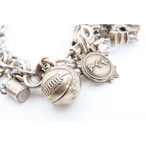 1312 - Silver Charm Bracelet Laden with Various Charms 20cm Long