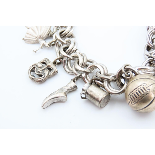 1312 - Silver Charm Bracelet Laden with Various Charms 20cm Long