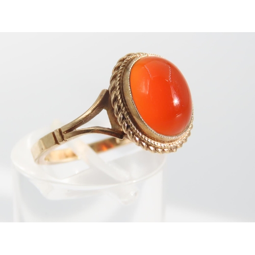 1325 - Cabochon Oval Cut Red Gemstone Ring Mounted on 9 Carat Yellow Gold Band Basset Set Ring Size O