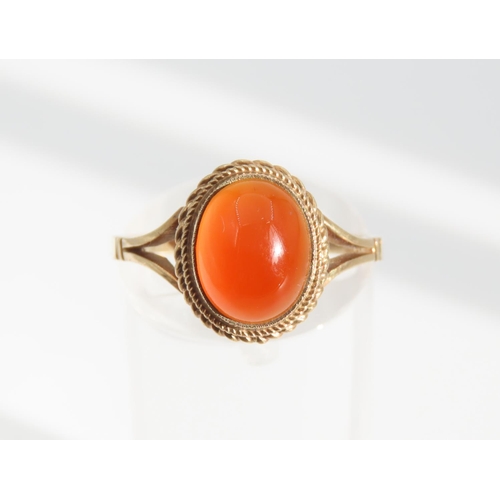 1325 - Cabochon Oval Cut Red Gemstone Ring Mounted on 9 Carat Yellow Gold Band Basset Set Ring Size O