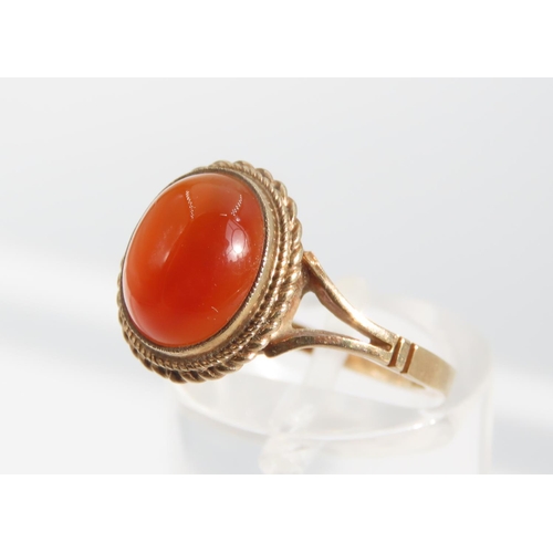 1325 - Cabochon Oval Cut Red Gemstone Ring Mounted on 9 Carat Yellow Gold Band Basset Set Ring Size O