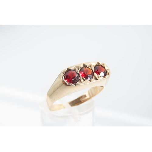 1329 - Three Stone Garnet Set Ladies Ring Mounted on 9 Carat Yellow Gold Band Ring Size S and a Half