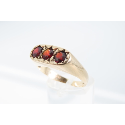 1329 - Three Stone Garnet Set Ladies Ring Mounted on 9 Carat Yellow Gold Band Ring Size S and a Half