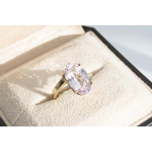 1333 - Kunzite Oval Cut Four Claw Set Ladies Centre Stone Ring Mounted on 9 Carat Yellow Gold Band