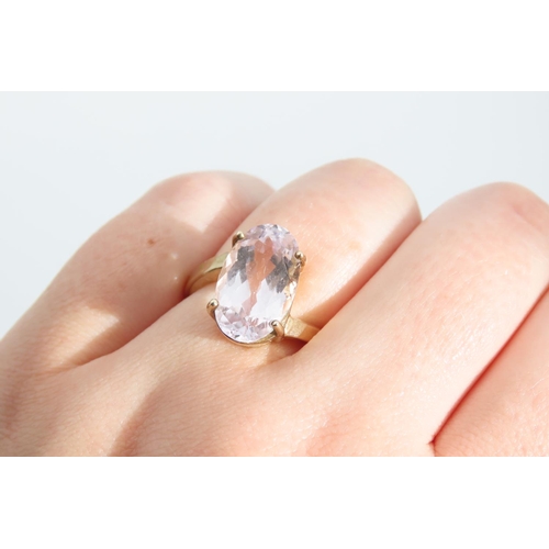 1333 - Kunzite Oval Cut Four Claw Set Ladies Centre Stone Ring Mounted on 9 Carat Yellow Gold Band