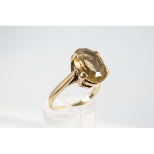 1337 - Smokey Quartz Statement Ring Oval Cut Four Claw Setting Mounted on 9 Carat Yellow Gold Band Ring