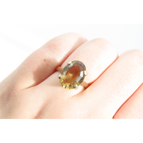 1337 - Smokey Quartz Statement Ring Oval Cut Four Claw Setting Mounted on 9 Carat Yellow Gold Band Ring