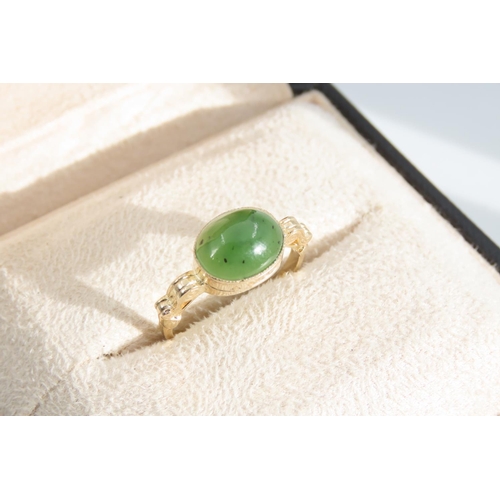 1338 - Jade Cabochon Polished Oval Cut Centre Stone Ring Mounted on 9 Carat Yellow Gold Band Ring