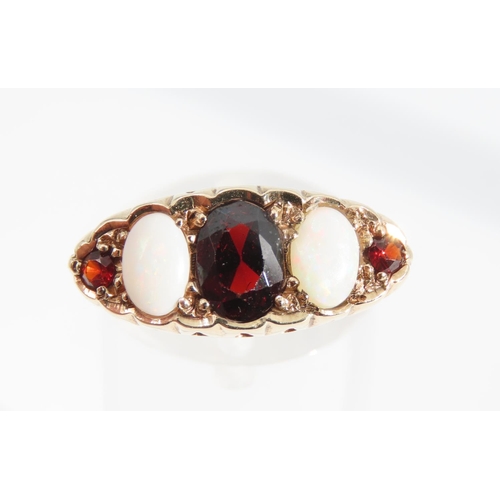 1340 - Garnet and Opal Five Stone Ring Mounted on 9 Carat Gold Band Size P