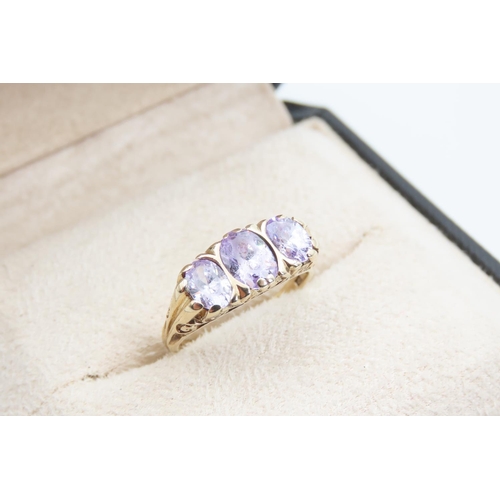 1342 - Three Stone Violet Sapphire and Diamond 9 Carat Yellow Gold Ring Size O