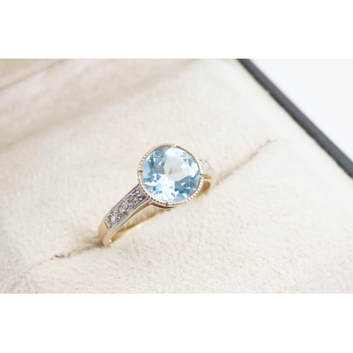 1389 - Blue Topaz and Diamond Set Ladies Ring Mounted on 9 Carat Yellow Gold Band Ring Size P