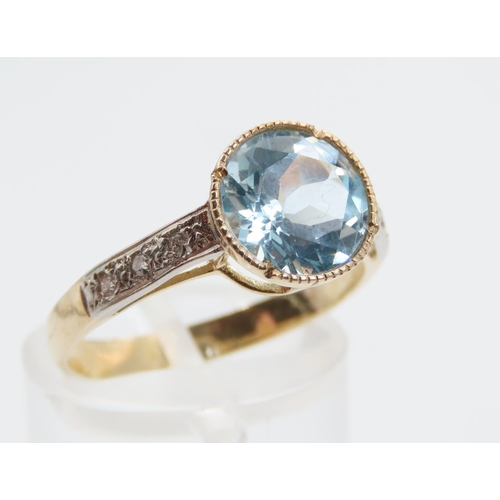 1389 - Blue Topaz and Diamond Set Ladies Ring Mounted on 9 Carat Yellow Gold Band Ring Size P