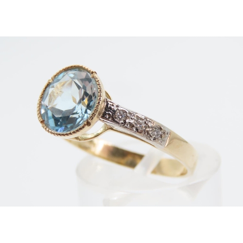 1389 - Blue Topaz and Diamond Set Ladies Ring Mounted on 9 Carat Yellow Gold Band Ring Size P