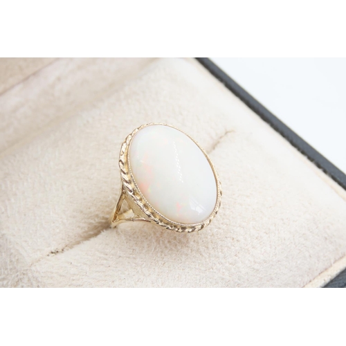 1394 - Opal Centre Stone Ring Mounted on 9 Carat Yellow Gold Band Ring Size O