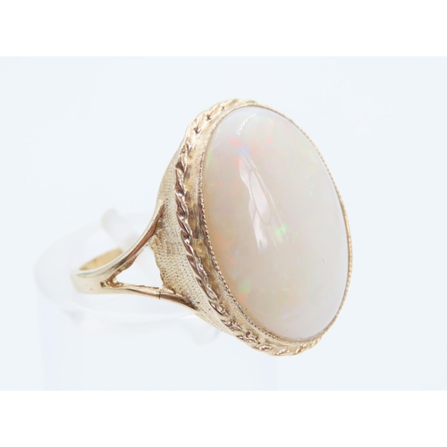 1394 - Opal Centre Stone Ring Mounted on 9 Carat Yellow Gold Band Ring Size O