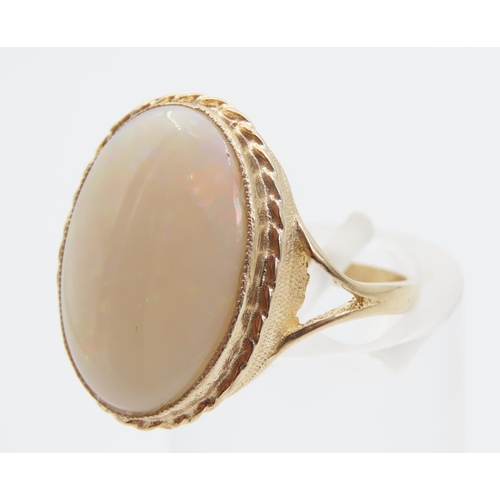 1394 - Opal Centre Stone Ring Mounted on 9 Carat Yellow Gold Band Ring Size O