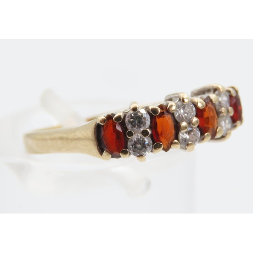 1407 - Garnet Four Stone and Diamond Band Ring Platinum Set Mounted on 9 Carat Gold Size K