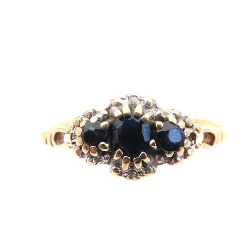 1409 - Sapphire and Diamond Ladies Ring Mounted on 9 Carat Yellow Gold Band Ring Size R