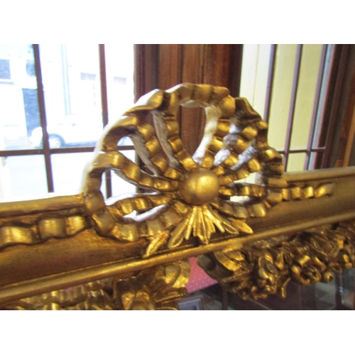 142 - Gilded Rectangular Form Wall Mirror Upper Ribbon Decoration Approximately 6ft High x 2ft 8 Inches Wi... 