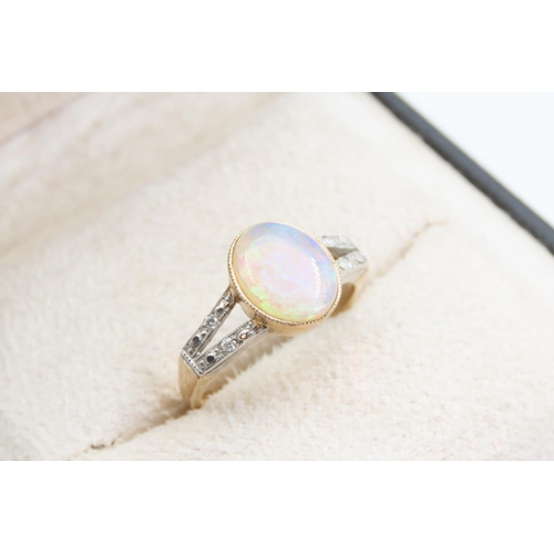 1420 - Opal Centre Stone Ring Mounted on 9 Carat Yellow Gold Band Further Diamond Decoration to Twin Band S... 