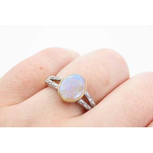 1420 - Opal Centre Stone Ring Mounted on 9 Carat Yellow Gold Band Further Diamond Decoration to Twin Band S... 