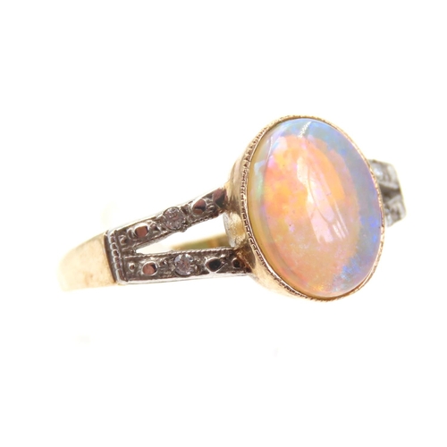 1420 - Opal Centre Stone Ring Mounted on 9 Carat Yellow Gold Band Further Diamond Decoration to Twin Band S... 