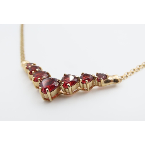 1466 - Red Garnet Set Seven Stone Graduated Form Necklace Mounted in 9 Carat Yellow Gold Further Set on 9 C... 