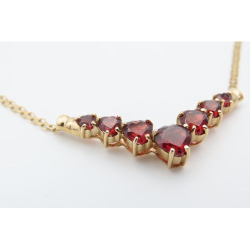 1466 - Red Garnet Set Seven Stone Graduated Form Necklace Mounted in 9 Carat Yellow Gold Further Set on 9 C... 