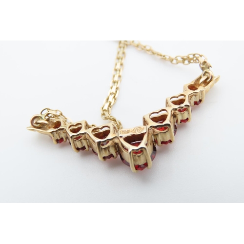 1466 - Red Garnet Set Seven Stone Graduated Form Necklace Mounted in 9 Carat Yellow Gold Further Set on 9 C... 