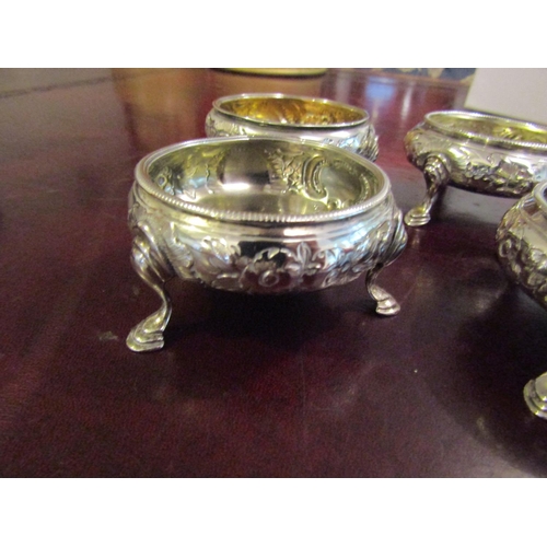 167 - Four Georgian Silver Salt Cauldrons with Embossed Floral Design above Shaped Supports Hallmarked Lon... 