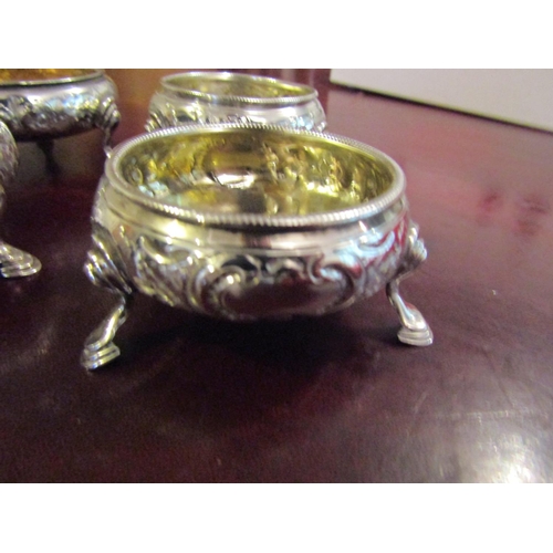 167 - Four Georgian Silver Salt Cauldrons with Embossed Floral Design above Shaped Supports Hallmarked Lon... 