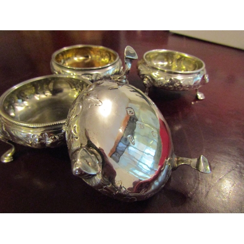 167 - Four Georgian Silver Salt Cauldrons with Embossed Floral Design above Shaped Supports Hallmarked Lon... 