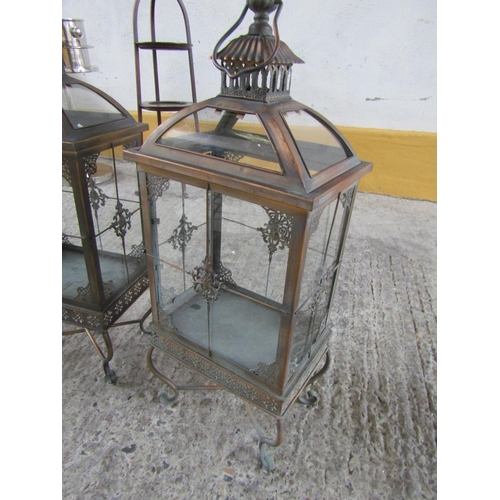 299 - Pair of Metal Framed Glass Inset Candle Storm Lanterns Shaped Supports Each Approximately 28 Inches ... 