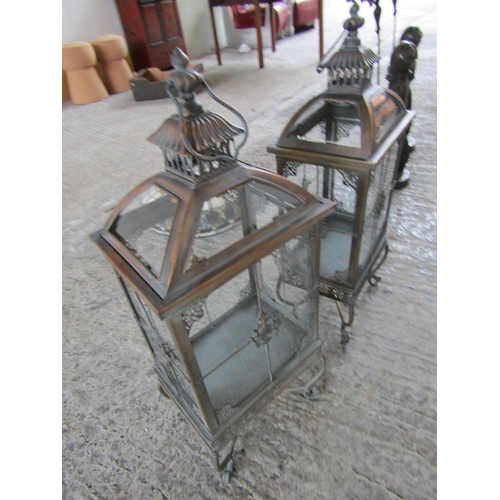 299 - Pair of Metal Framed Glass Inset Candle Storm Lanterns Shaped Supports Each Approximately 28 Inches ... 