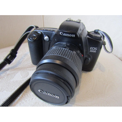 304 - Cannon Camera Model EOS 3000 with Additional Lense and Padded Carry Case