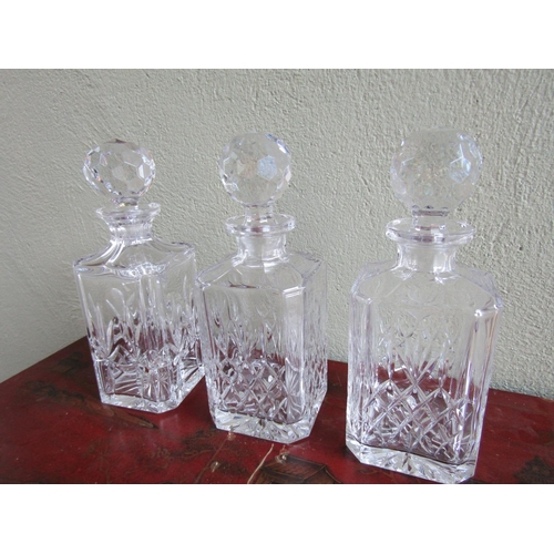 332 - Set of Three Cut Crystal Decanters with Original Crystal Stoppers Each Approximately 10 Inches High