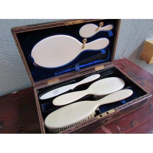 345 - Dressing Table Box Gilt Leather Inset Carry Handle Containing Five Piece Brush Set within Navy Velve... 