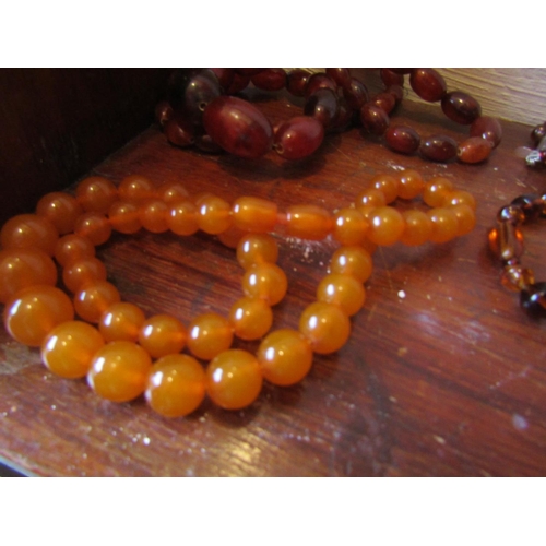 85 - Six Amber Bead Necklaces