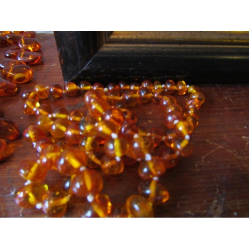 85 - Six Amber Bead Necklaces