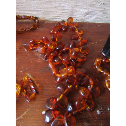 85 - Six Amber Bead Necklaces