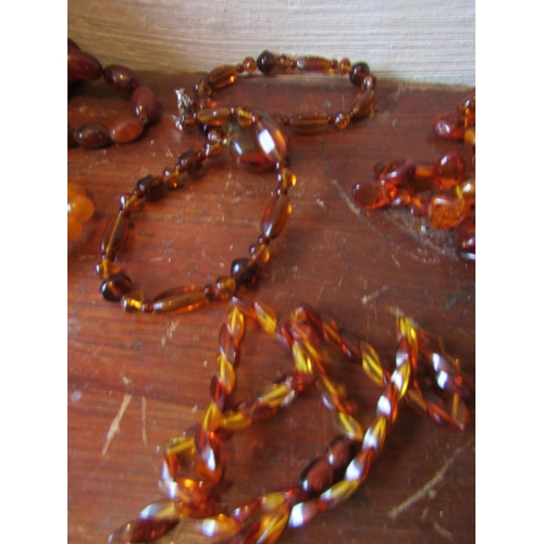 85 - Six Amber Bead Necklaces