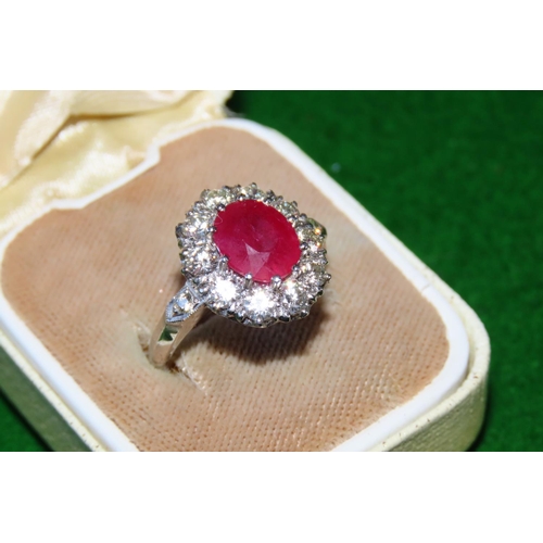 1056 - Ruby and Diamond Cluster Ring Mounted on Platinum and 14 Carat Gold Band Size N and a Half