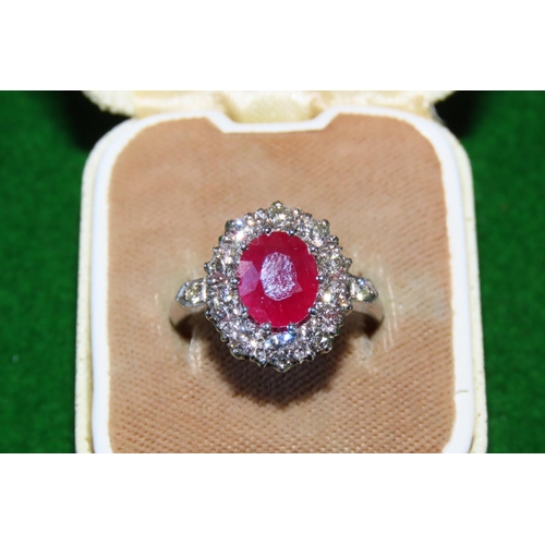 1056 - Ruby and Diamond Cluster Ring Mounted on Platinum and 14 Carat Gold Band Size N and a Half