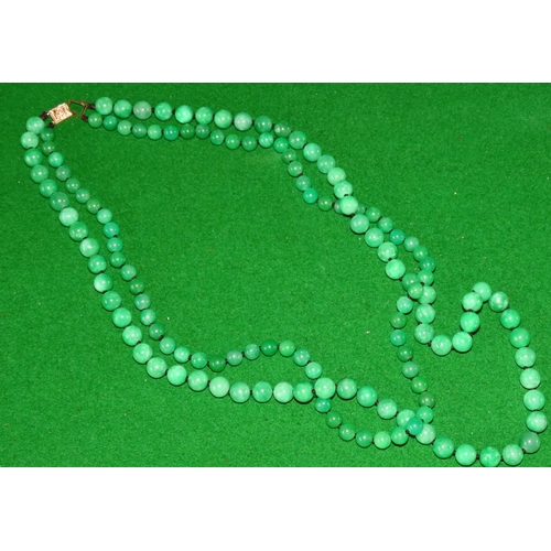 1073 - Carved Jade Twin Strand Bead Necklace of Attractive Colour and Hue with 14 Carat Yellow Gold Clasp S... 