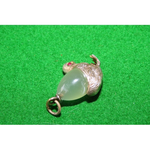 1076 - Silver Mounted Green Chalcedony Chic Motif Pendant Inset with Ruby Eyes