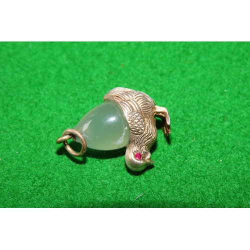 1076 - Silver Mounted Green Chalcedony Chic Motif Pendant Inset with Ruby Eyes